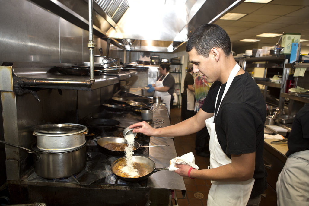 man cooking on the line